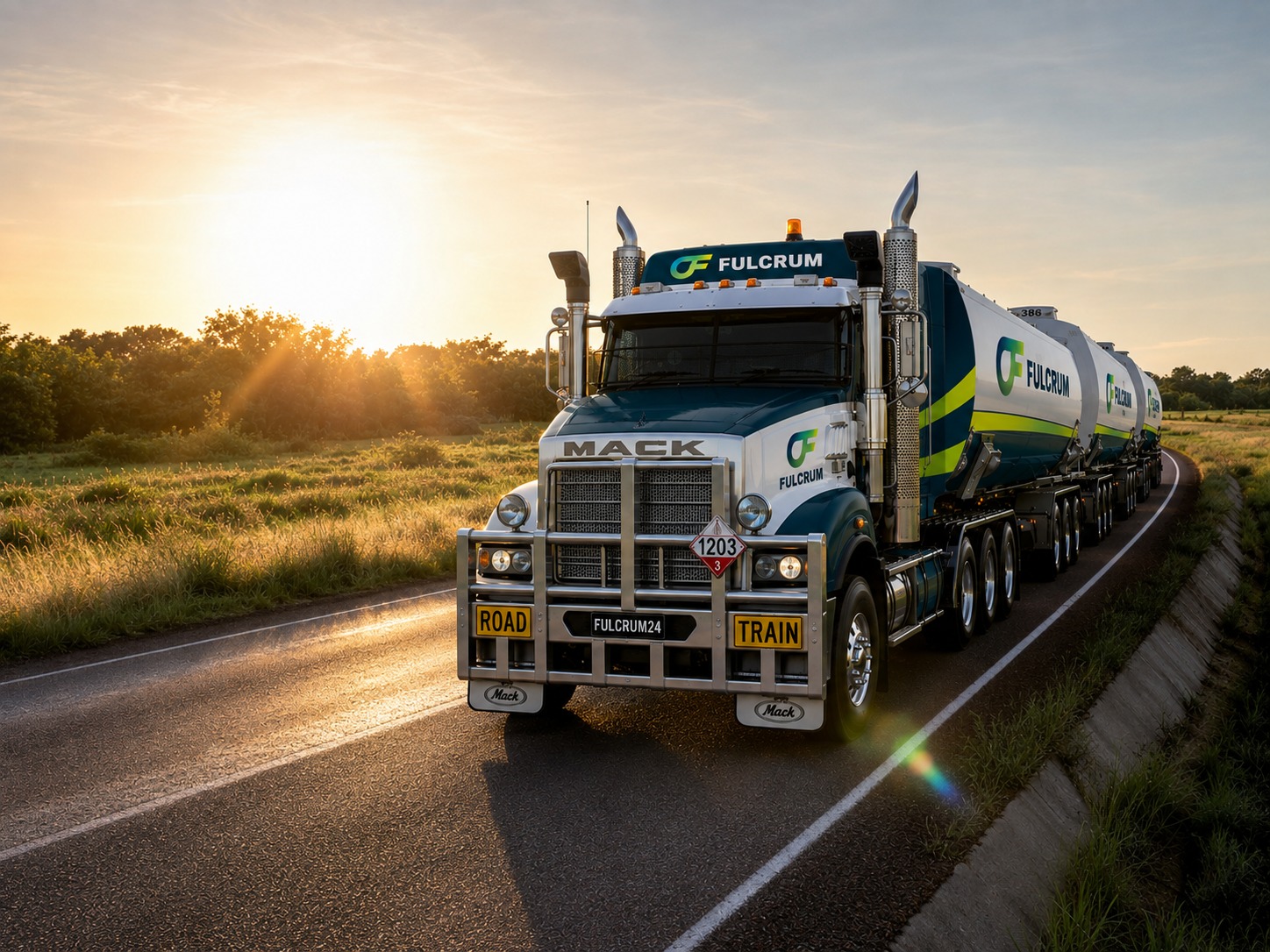 Fulcrum-branded fuel tanker road train hauling product along a highway at sunrise